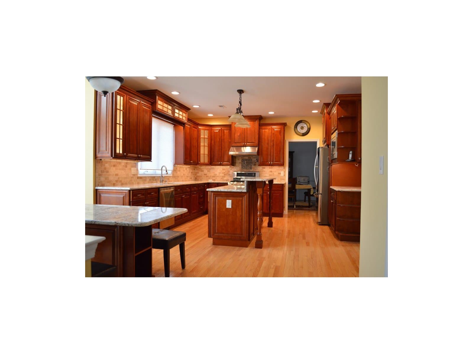 Traditional cherry kitchen with raised panel doors and applied moldings